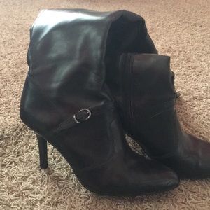 Knee-high black heeled boots